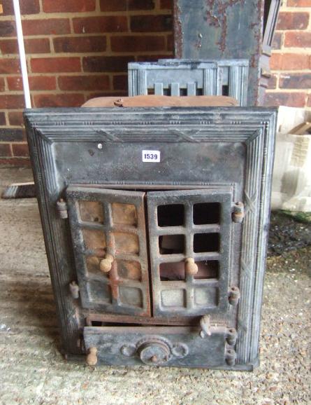 Appraisal: A cast iron wood burning stove by 'The Cozy Stove