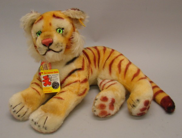 Appraisal: Lying Tiger Apricot and white mohair with airbrushed highlights Green