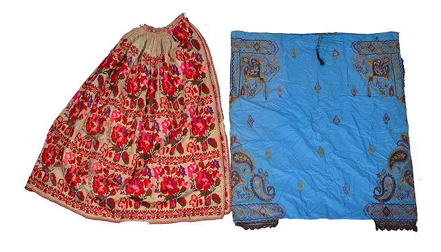 Appraisal: A BALKAN LINEN SKIRT with polychrome embroidered wool work decoration