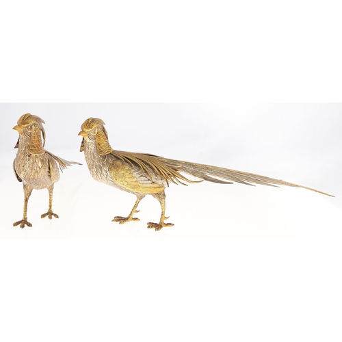 Appraisal: A pair of Continental parcel gilt silver pheasant table ornaments