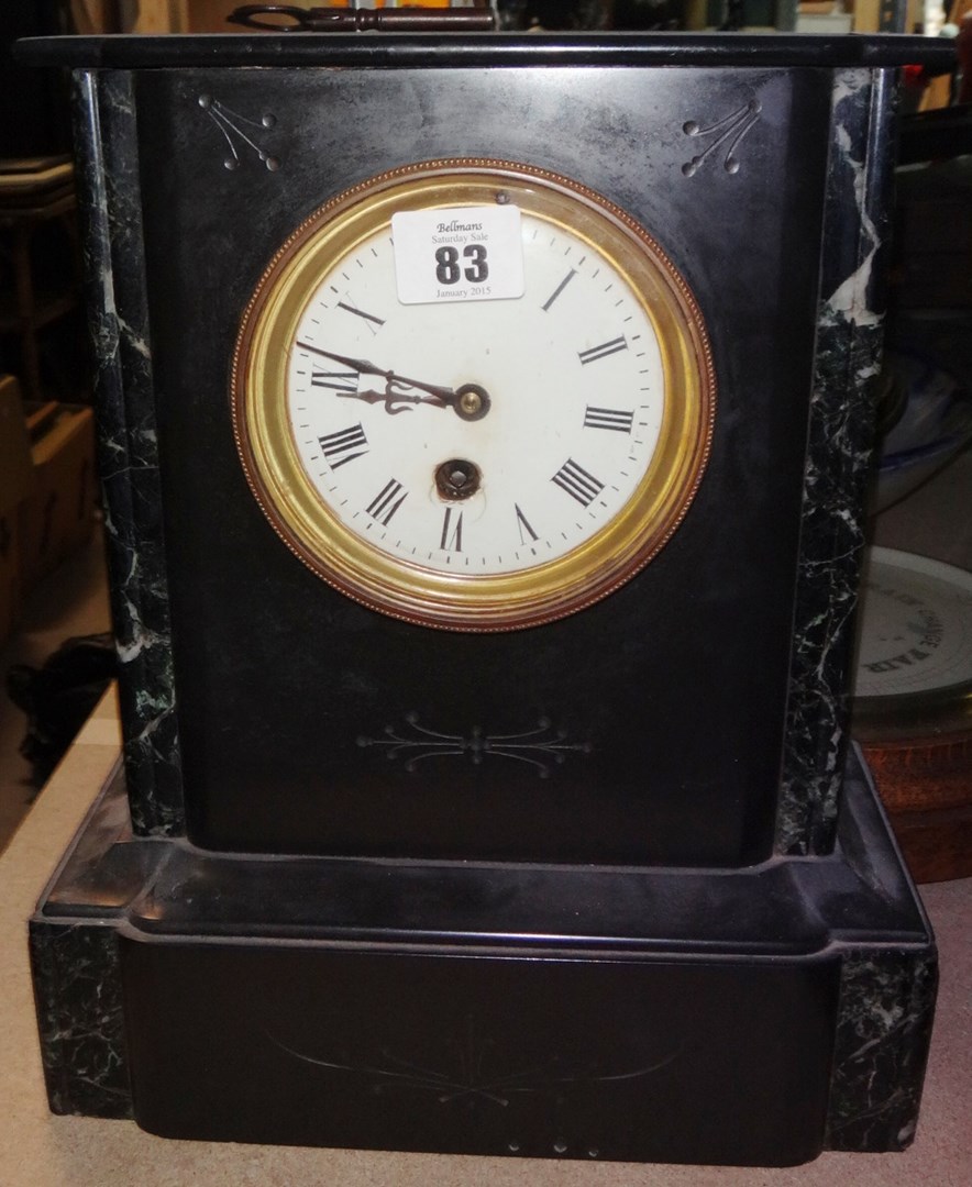 Appraisal: A black slate cased mantel clock