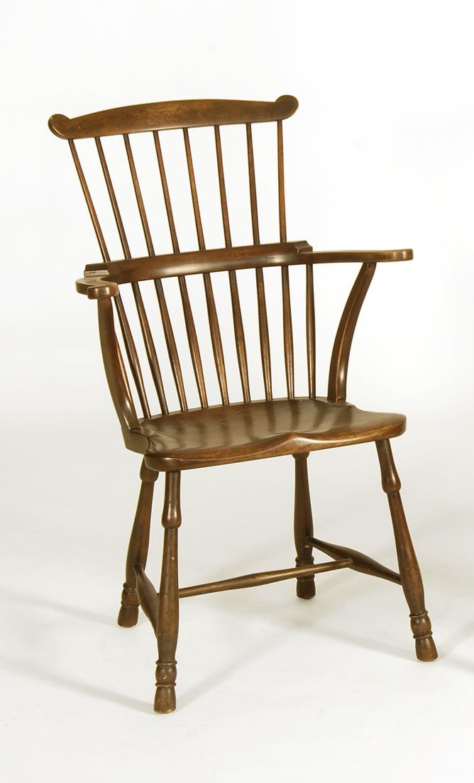 Appraisal: REPRODUCTION FANBACK CONTINUOUS-ARM CHAIR With plank seat Marked under seat