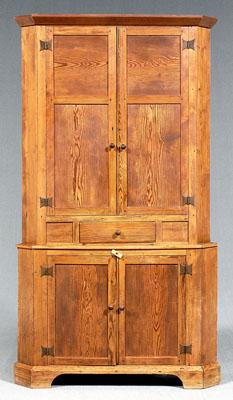 Appraisal: Southern yellow pine corner cupboard step back design one-case construction