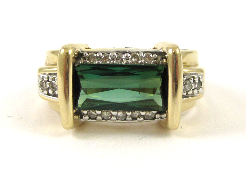 Appraisal: GREEN TOURMALINE AND FOURTEEN KARAT GOLD RING set with round-cut