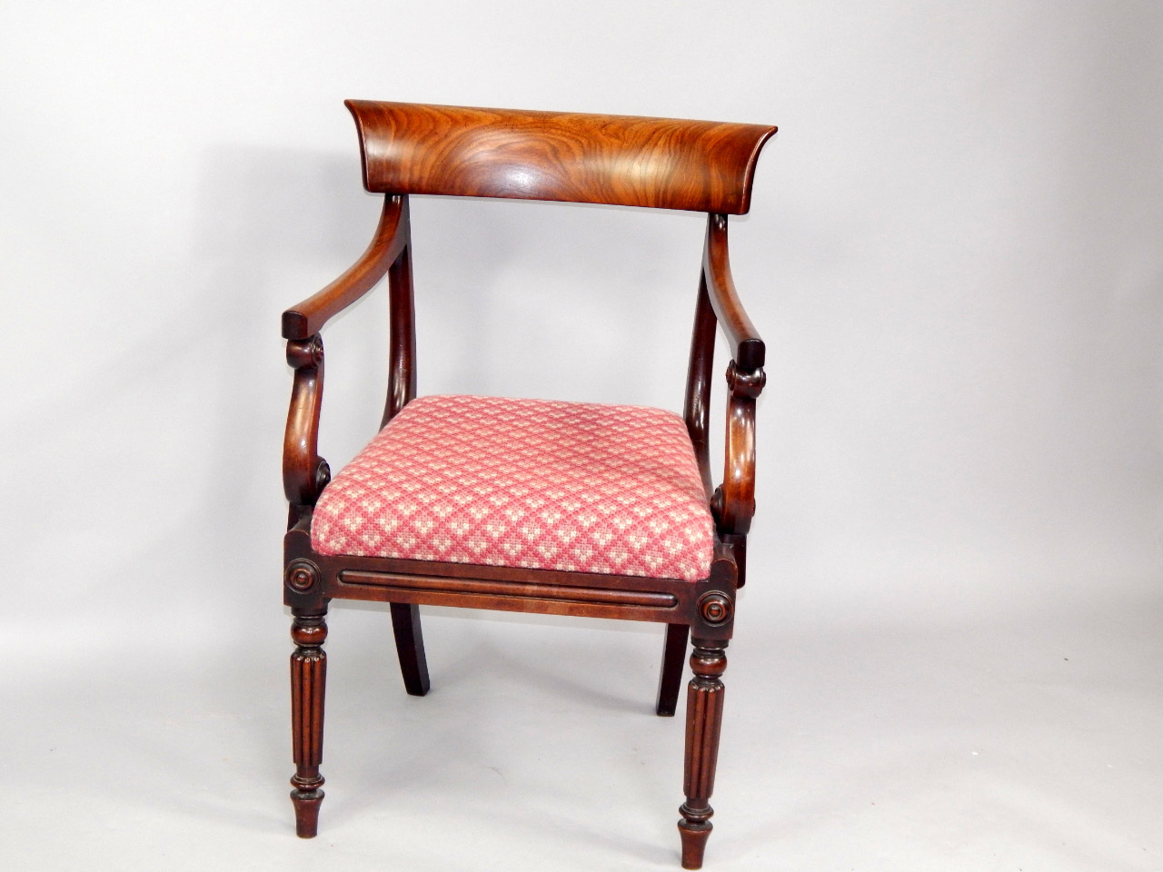 Appraisal: A William IV mahogany open armchair with scroll supports to