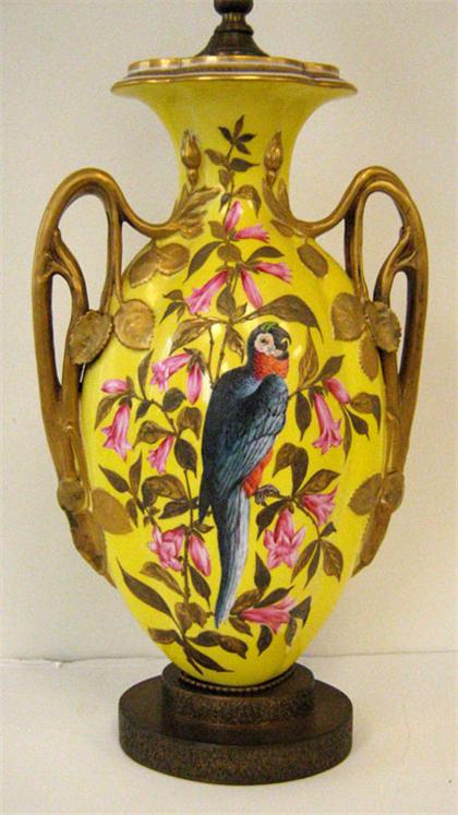 Appraisal: French porcelain twin handle vase yellow ground decorated with bird