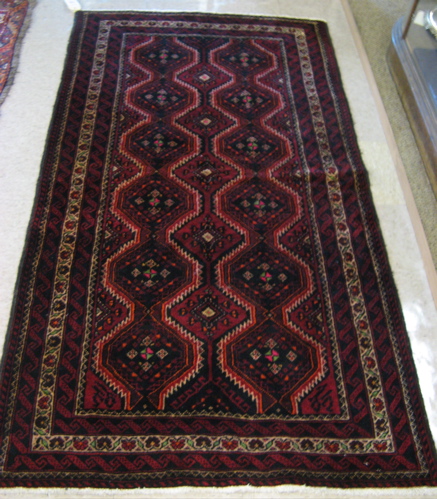 Appraisal: TWO PERSIAN BELOUCHI TRIBAL AREA RUGS both geometric pattern '