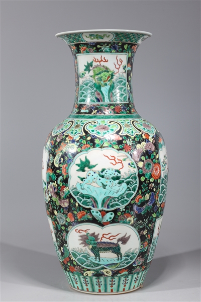 Appraisal: Chinese black ground famille verte enameled porcelain vase with mythical