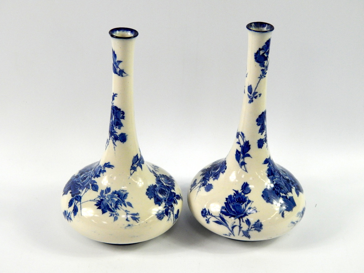 Appraisal: A pair of Royal Doulton pottery slender neck vases decorated