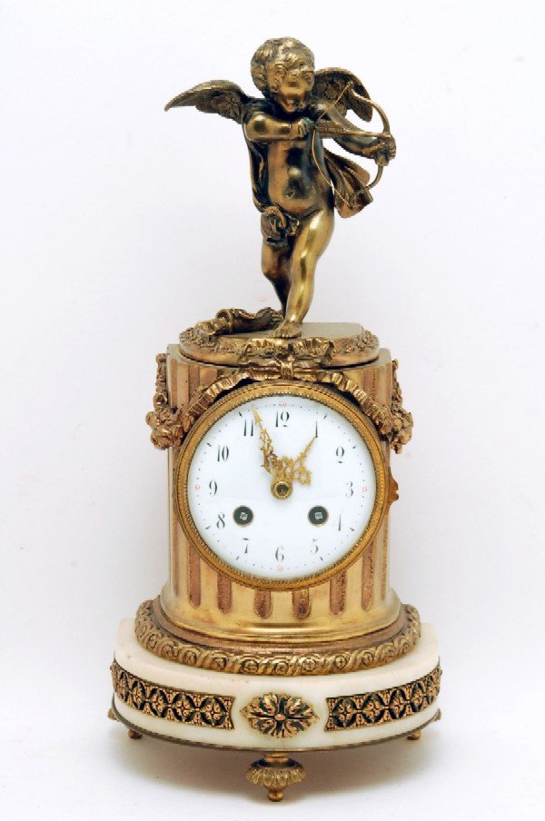 Appraisal: French figural clock Ribbed bronze body with applied fruit and