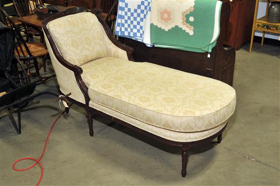 Appraisal: CHAISE LOUNGE Contemporary lounge having a floral carved mahogany frame