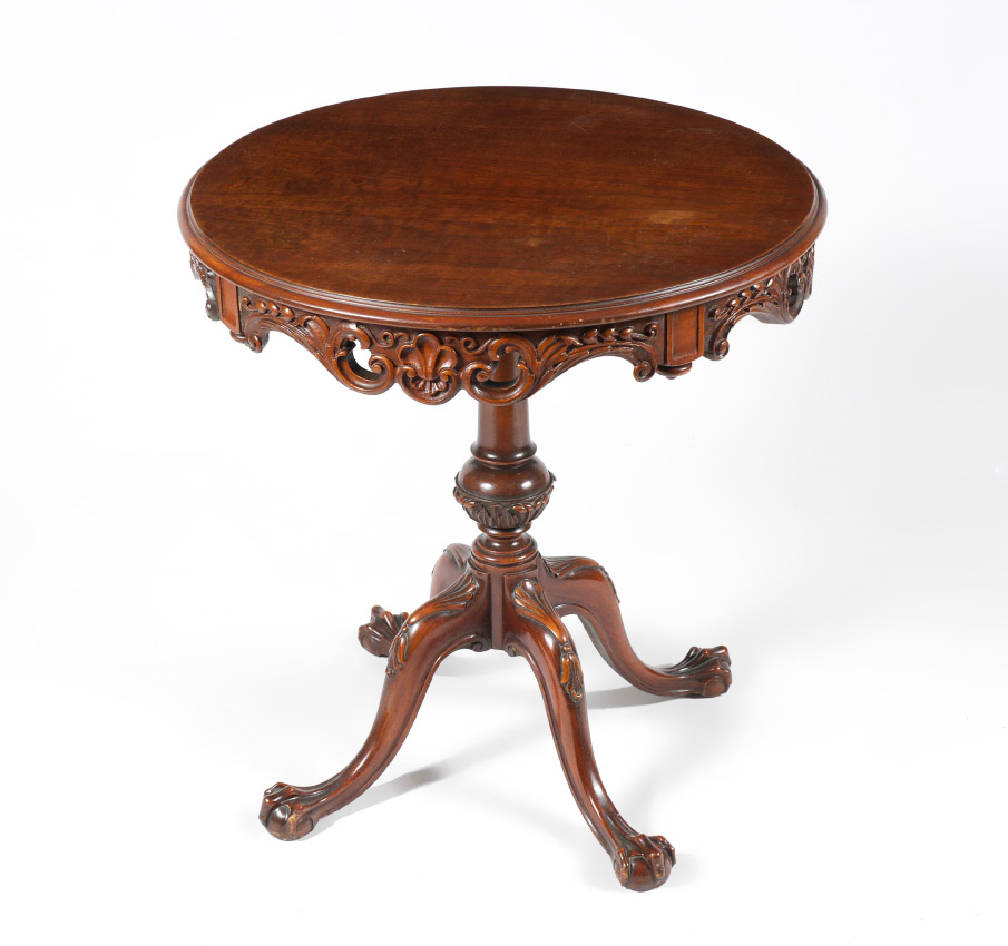 Appraisal: CARVED MAHOGANY OCCASIONAL TABLE th century round top foliate motif