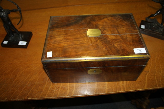 Appraisal: A VICTORIAN WALNUT TRAVELLING WRITING BOX with fitted inkwells and