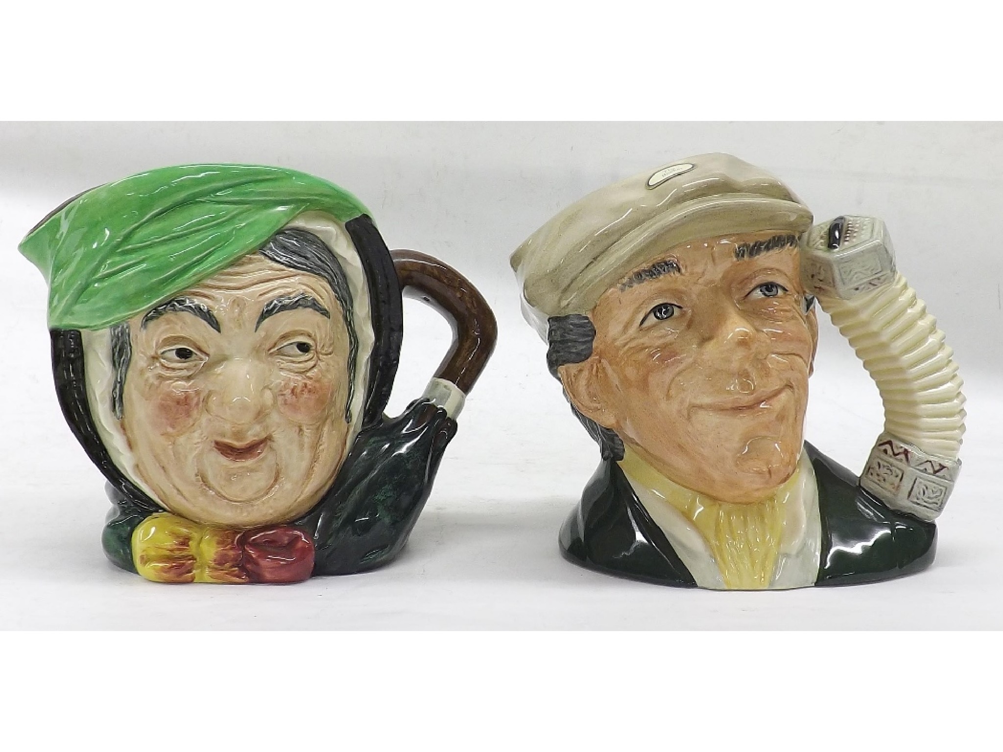 Appraisal: Royal Doulton character jug - The Busker D high and