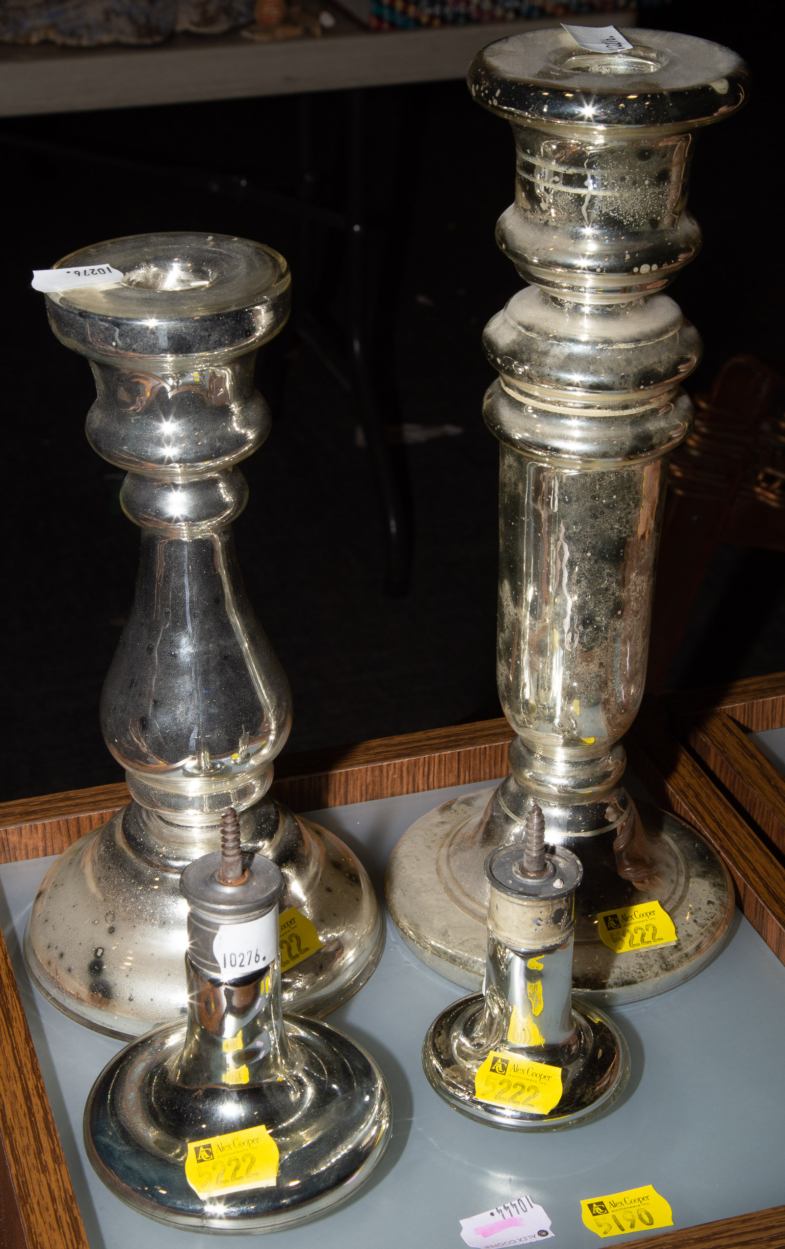 Appraisal: FOUR PIECES OF MERCURY GLASS Includes two candlesticks - in