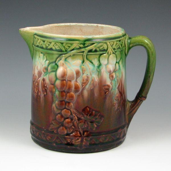 Appraisal: Roseville early blended glaze grape pitcher Unmarked Chips and flakes