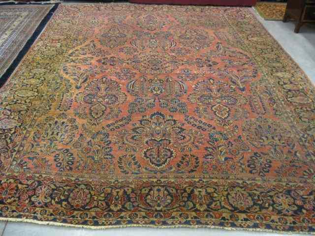 Appraisal: Sarouk Persian Handmade Room Size Rug semi-antique elaborate floral red