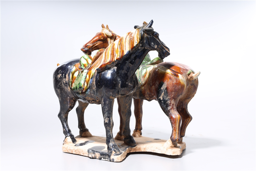 Appraisal: Chinese Sancai-style pottery group of two horses x x approx