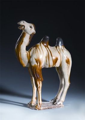 Appraisal: A Chinese treacle-glazed pottery model of a bactrian camel his