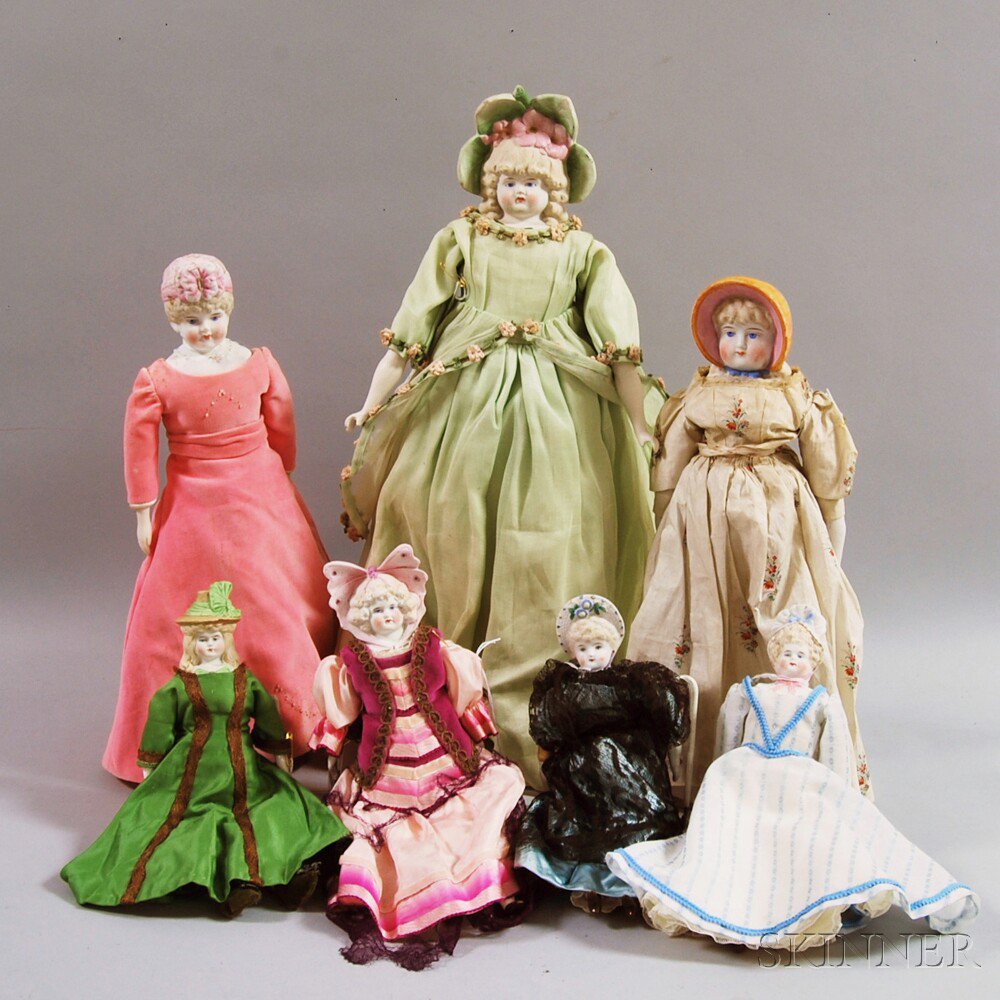 Appraisal: Seven Bisque Bonnet Head Dolls probably Hertwig Germany wearing a