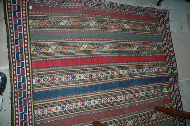 Appraisal: A KILIM FLOOR RUG With a repeating geometric pattern x