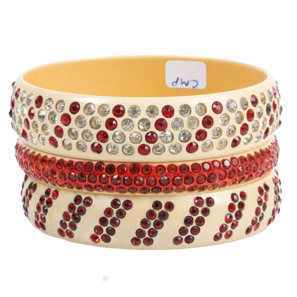 Appraisal: THREE RED ON CREAM CELLULOID SPARKLER BANGLE BRACELETS INNER DIAM