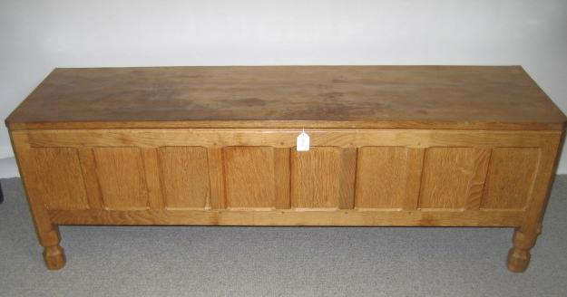 Appraisal: AN ADZED OAK BLANKET BOX by Robert Mouseman Thompson of