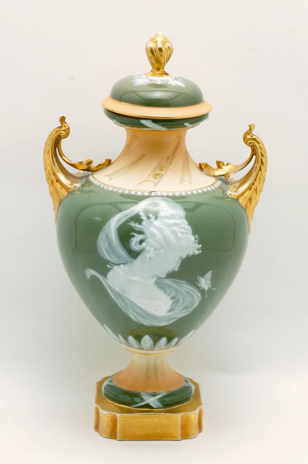 Appraisal: Large pate sur pate covered vase urn form with two