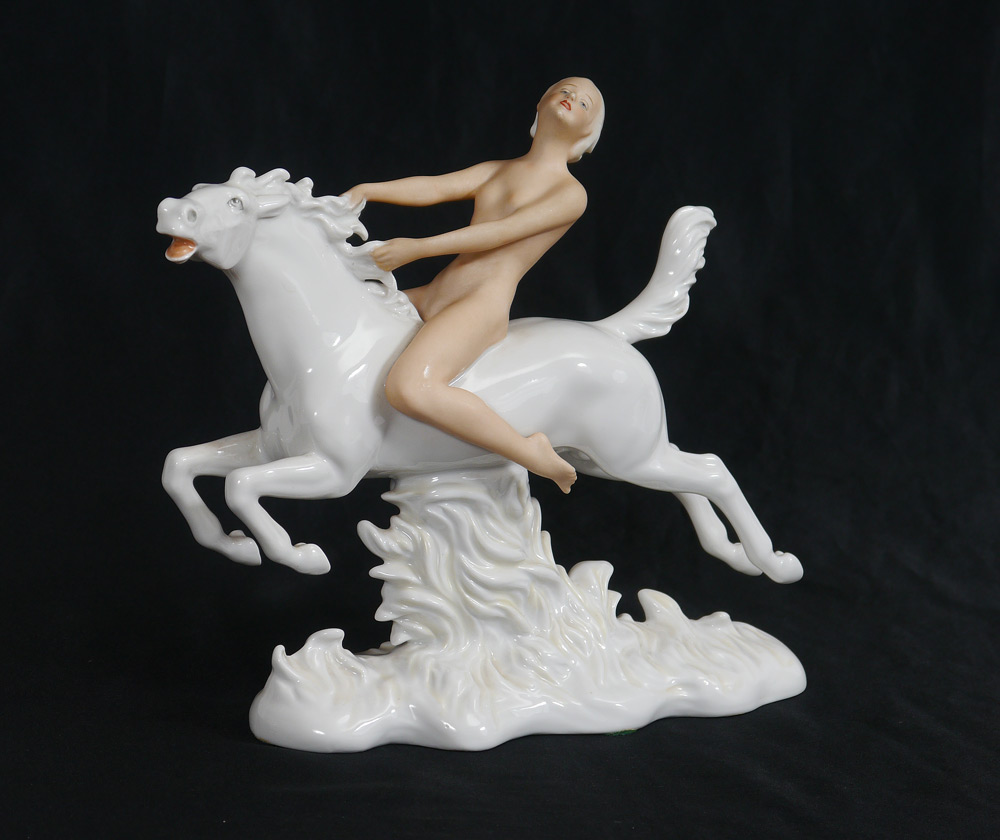 Appraisal: SCHAUBACH KUNST FIGURE OF NUDE ON HORSE Nude figure riding