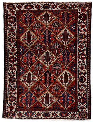 Appraisal: Baktiari rug repeating diamond designs on brick red field ivory