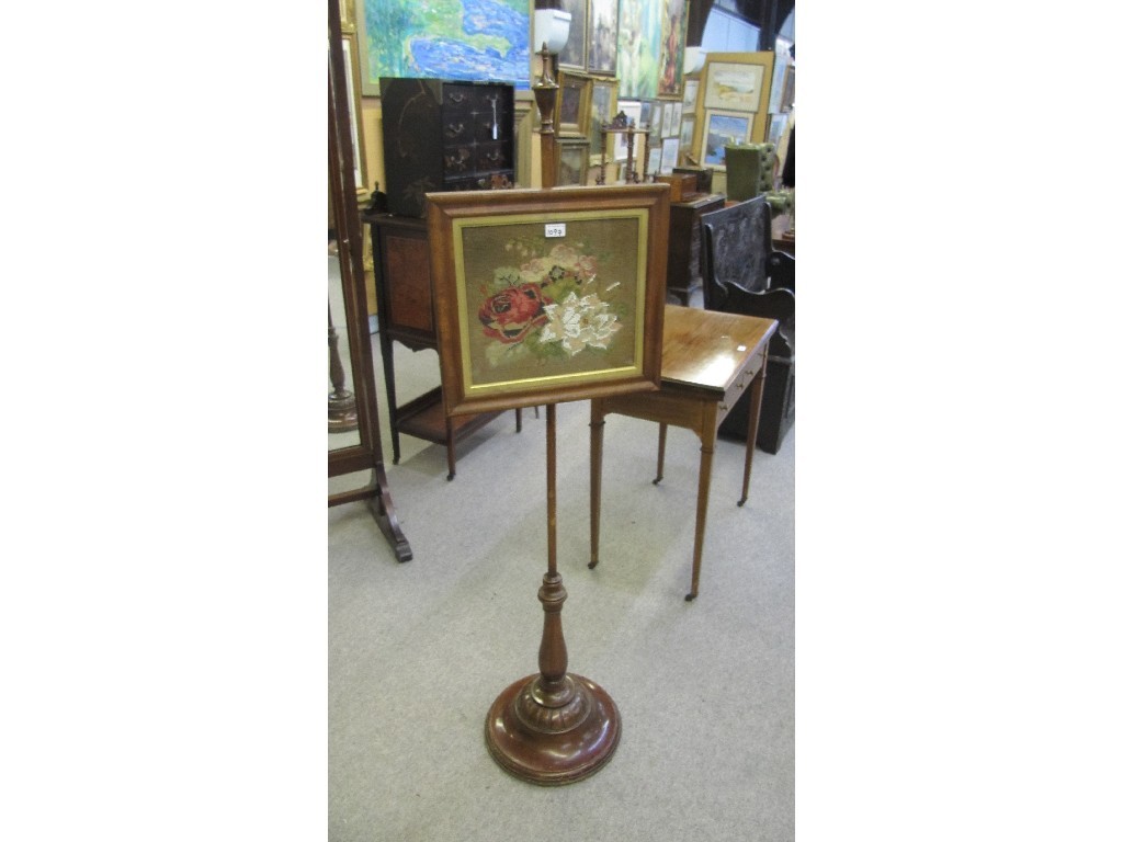 Appraisal: Edwardian mahogany pole screen with embroidered panel