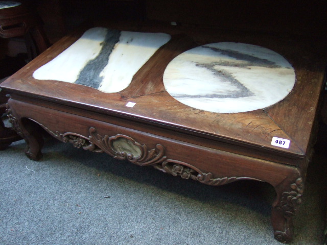 Appraisal: A th century Chinese low coffee table with a pair