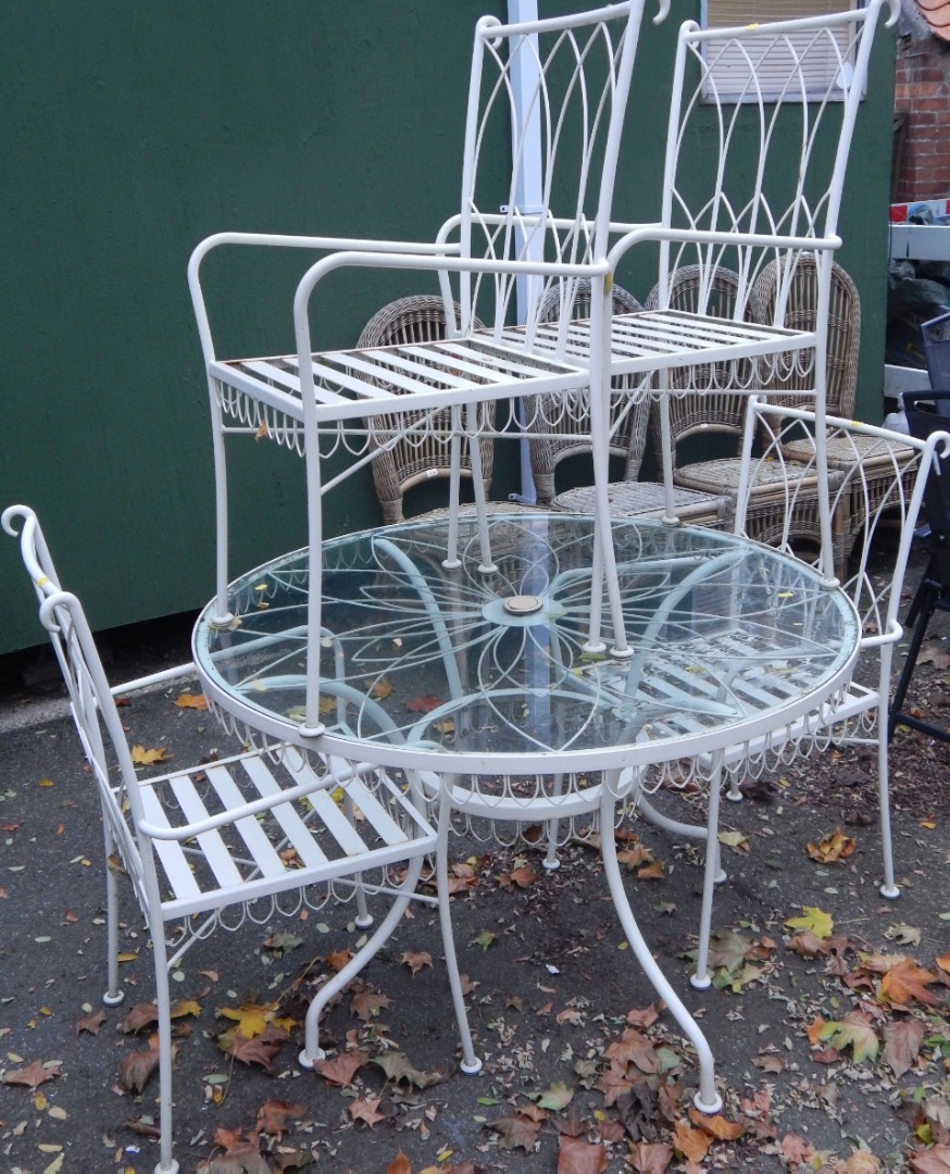 Appraisal: A cream painted circular cast iron garden table with glass