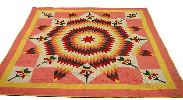 Appraisal: Quilt with yellow red green pink and white patches featuring