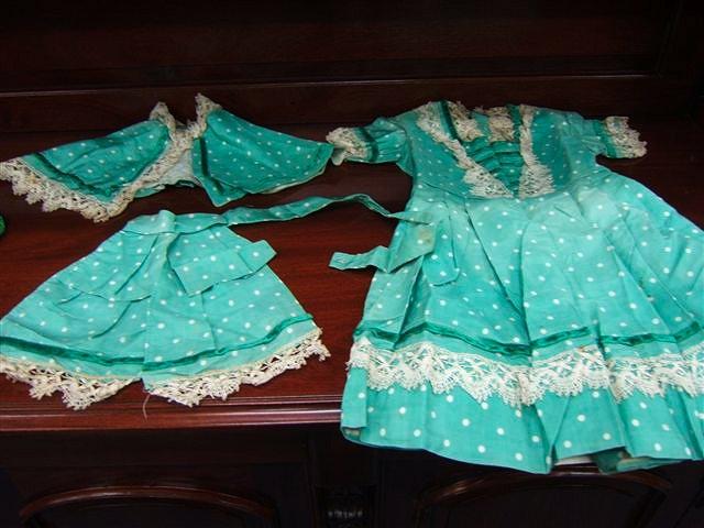 Appraisal: A Victorian child's green silk and white polka dot dress