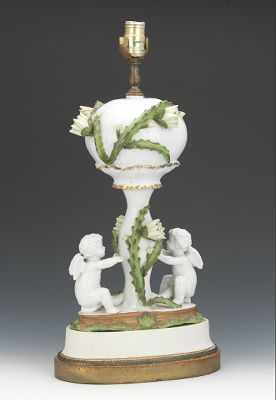 Appraisal: A Porcelain Lamp with Flowering Cactus and Cherubs Porcelain with