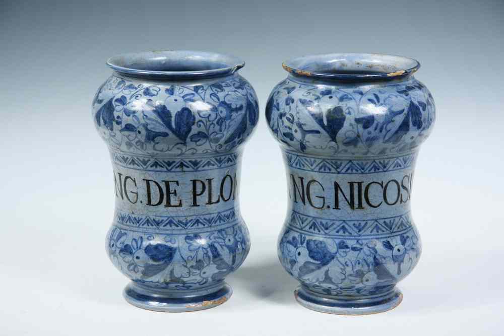 Appraisal: POTTERY APOTHECARY JARS - Two th c Italian Glazed Pottery