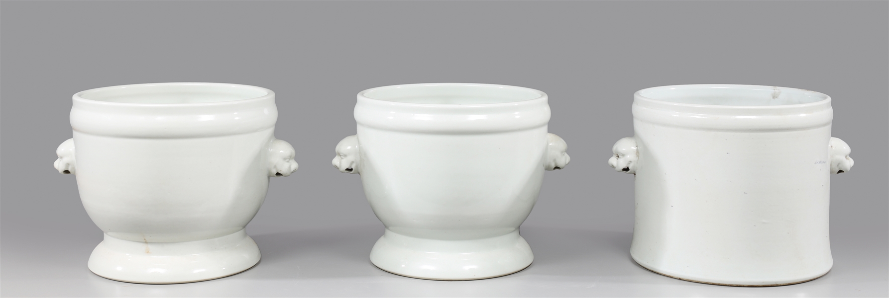 Appraisal: Group of three Chinese white glazed porcelain planters each with