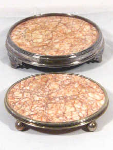 Appraisal: A pair of silver plate and marble hot plate stands