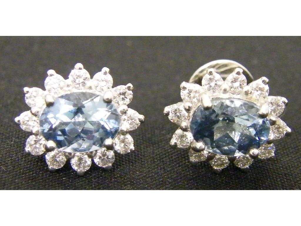 Appraisal: Attractive pair of k oval white gold cluster earrings set