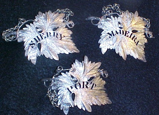 Appraisal: Three sterling liquor labels circa George IV London maker's mark