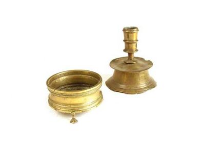 Appraisal: A Flemish brass candlestick of Heemskerk type with a mid