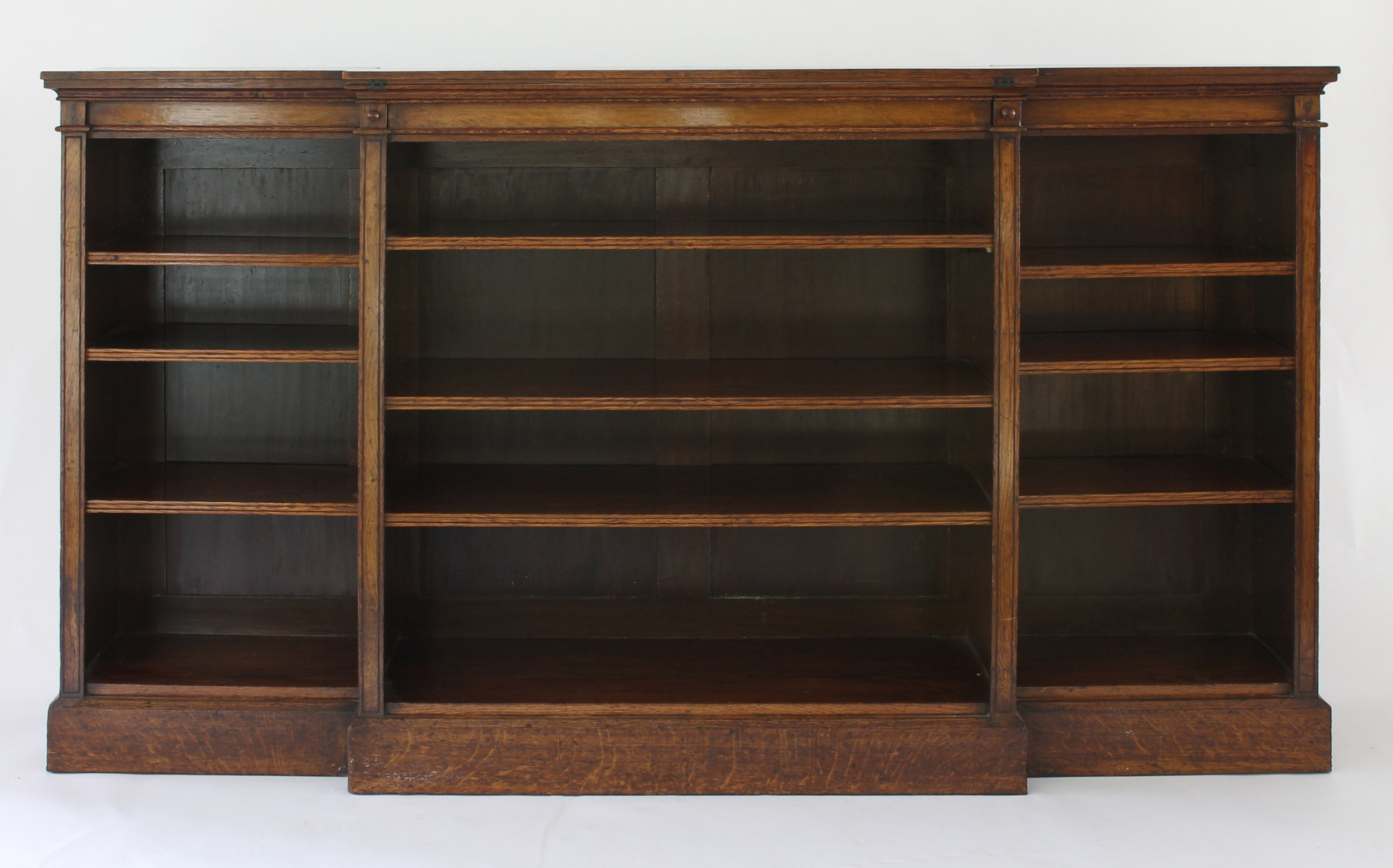 Appraisal: A Gillow and Co burr oak breakfront library bookcase fitted