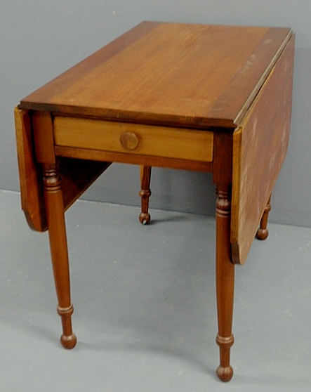 Appraisal: Sheraton cherry drop-leaf table c with shaped leaves and single