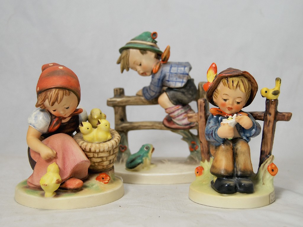 Appraisal: Three Hummell figure groups - Girl feeding chicks Boy on