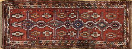 Appraisal: KURD KAZAK RUNNER The terracotta ground with line of stepped