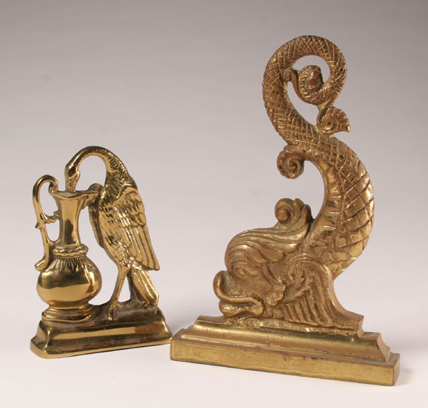 Appraisal: Brass doorstops dolphin-like denizen and lyrical bird with ewer Tallest