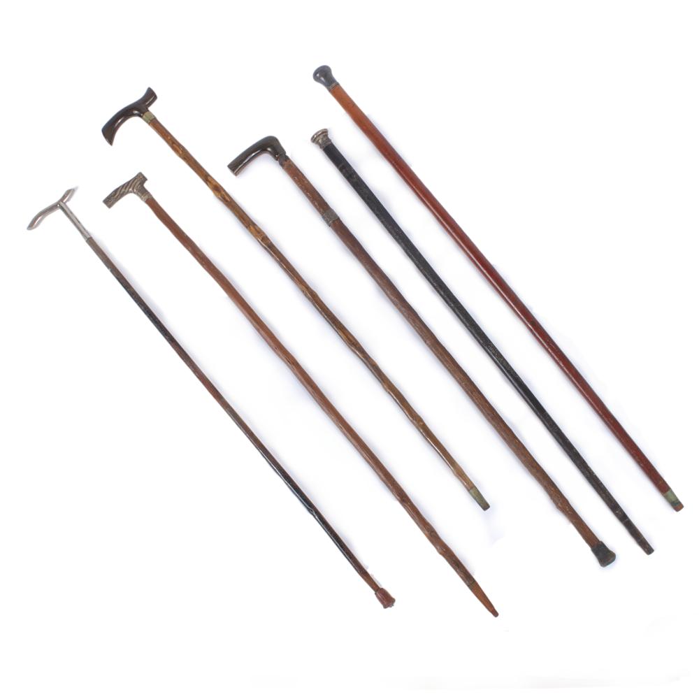 Appraisal: SIX VINTAGE WALKING STICKS CANES WITH DECORATIVE WOOD SILVER AND