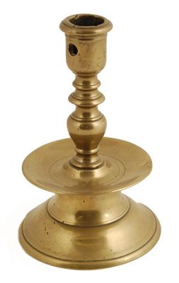 Appraisal: A th century North European brass candlestick raised on a