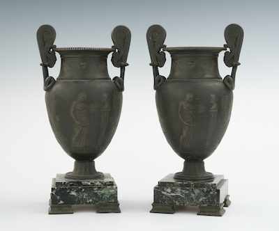 Appraisal: A Pair of Handsome Neoclassical Urns The urns are relief